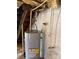 Modern water heater with visible pipes and connections, set against a clean, insulated wall for efficient performance at 4421 Linwood Rd, Gastonia, NC 28052