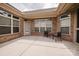 Spacious brick back patio features a seating area for relaxing outdoors at 4518 Courtyard Blvd # 4, Harrisburg, NC 28075