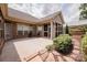 Home's backyard boasts an expansive concrete patio with beautiful landscaping and mature trees at 4518 Courtyard Blvd # 4, Harrisburg, NC 28075