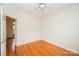 Cozy bedroom with hardwood floors and a ceiling fan, offering a serene and comfortable atmosphere at 4518 Courtyard Blvd # 4, Harrisburg, NC 28075