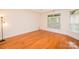 Bedroom with hardwood floors and light from several windows at 4518 Courtyard Blvd # 4, Harrisburg, NC 28075