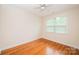 Inviting bedroom with neutral walls, hardwood floors, a ceiling fan, and a window, creating a calming retreat at 4518 Courtyard Blvd # 4, Harrisburg, NC 28075