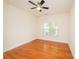 Serene bedroom features hardwood floors, a ceiling fan, and a window, offering a peaceful and comfortable space at 4518 Courtyard Blvd # 4, Harrisburg, NC 28075