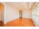 Spacious dining room features hardwood floors, decorative chandelier, and ample natural light at 4518 Courtyard Blvd # 4, Harrisburg, NC 28075