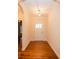 Inviting foyer with hardwood floors, neutral walls, a white front door, and elegant trim, creating a welcoming entrance at 4518 Courtyard Blvd # 4, Harrisburg, NC 28075