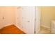 Hallway featuring hardwood floors, white doors, and modern trim at 4518 Courtyard Blvd # 4, Harrisburg, NC 28075