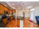 Modern kitchen features granite countertops, stainless steel appliances, and warm wood cabinets at 4518 Courtyard Blvd # 4, Harrisburg, NC 28075