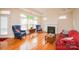 Bright living room with hardwood floors, fireplace, ample natural light, and stylish furnishings at 4518 Courtyard Blvd # 4, Harrisburg, NC 28075