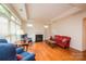 Bright living room with hardwood floors, fireplace, ample natural light, and stylish furnishings at 4518 Courtyard Blvd # 4, Harrisburg, NC 28075