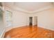 Main bedroom featuring hardwood floors, tray ceilings, and window seat at 4518 Courtyard Blvd # 4, Harrisburg, NC 28075