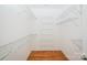 Walk-in closet providing ample storage with multiple wire shelves at 4518 Courtyard Blvd # 4, Harrisburg, NC 28075