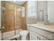 Tiled bathroom featuring glass shower enclosure, white vanity and tiled flooring at 463 Langston Place Dr, Fort Mill, SC 29708