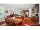 Open concept kitchen boasts stainless appliances, granite counters, and seamless flow to dining and living areas at 463 Langston Place Dr, Fort Mill, SC 29708