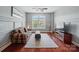Stylish living room features a plaid sofa, patterned rug, and large window at 463 Langston Place Dr, Fort Mill, SC 29708