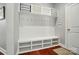 The mudroom features custom shelving, storage bench, and coat hooks for organization at 463 Langston Place Dr, Fort Mill, SC 29708