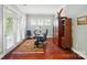 Bright office space with french doors to patio, hardwood floors, and custom built-ins for ample storage at 463 Langston Place Dr, Fort Mill, SC 29708