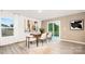 Dining room with a modern table set and light-filled windows, creating an inviting space at 4689 Fanning Rd, Hickory, NC 28602