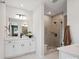 Clean, bright bathroom with double vanity and glass-enclosed shower at 502 Webster Ln, Cramerton, NC 28032