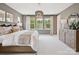 Spacious bedroom with neutral tones, large windows, and elegant chandelier at 502 Webster Ln, Cramerton, NC 28032