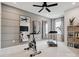 Well-equipped exercise room with modern equipment, mirrors, and natural light at 502 Webster Ln, Cramerton, NC 28032