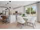 Modern kitchen open to a dining area with lots of natural light and backyard views at 502 Webster Ln, Cramerton, NC 28032