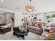 Open concept living room featuring modern decor and seamless flow into kitchen and dining at 502 Webster Ln, Cramerton, NC 28032