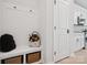 Well-organized mudroom with built-in bench, storage, and easy access to kitchen at 502 Webster Ln, Cramerton, NC 28032