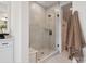 Contemporary shower with tiled walls and glass door in a bright bathroom at 502 Webster Ln, Cramerton, NC 28032