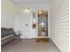 View of the front porch featuring an outdoor bench, accent flowers, and a glass storm door at 510 Sw Viking Sw Pl, Concord, NC 28025