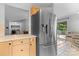 Kitchen with stainless steel refrigerator and view of laundry area, dining room and outdoor space at 510 Sw Viking Sw Pl, Concord, NC 28025