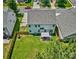 Aerial view of a fenced backyard with a patio, lush green grass, and well-maintained landscaping at 511 Rough Hewn Ln, Rock Hill, SC 29730