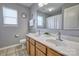 Well-lit bathroom features double sinks, a large mirror, neutral paint, and tiled floors at 511 Rough Hewn Ln, Rock Hill, SC 29730