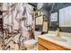 Bathroom with a patterned shower curtain, vanity, and mirror at 511 Rough Hewn Ln, Rock Hill, SC 29730