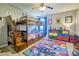Colorful bedroom with bunk beds, unique decor, a ceiling fan, and lots of storage space at 511 Rough Hewn Ln, Rock Hill, SC 29730