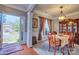 Elegant dining room with hardwood floors, chandelier, and classic furniture at 511 Rough Hewn Ln, Rock Hill, SC 29730