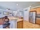 Open kitchen with granite countertops, stainless steel appliances, and breakfast bar at 511 Rough Hewn Ln, Rock Hill, SC 29730