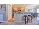 Open kitchen featuring a breakfast bar, stainless steel appliances, and adjoining dining area at 511 Rough Hewn Ln, Rock Hill, SC 29730