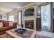 Cozy living room with a fireplace, TV, and comfortable seating at 511 Rough Hewn Ln, Rock Hill, SC 29730