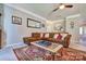 Comfortable living room featuring a plush sectional sofa, patterned rug, and stylish decor at 511 Rough Hewn Ln, Rock Hill, SC 29730