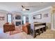 Spacious living room with a fireplace, ceiling fan, and cozy seating area at 511 Rough Hewn Ln, Rock Hill, SC 29730