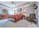 Spacious main bedroom with tray ceiling and four-poster bed at 511 Rough Hewn Ln, Rock Hill, SC 29730