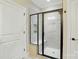 Modern bathroom featuring a tiled walk-in shower with a glass enclosure and built in bench at 6277 Raven Rock Dr, Denver, NC 28037