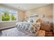 Bright bedroom with a large window, hardwood floors, neutral paint, and well-appointed furniture at 6277 Raven Rock Dr, Denver, NC 28037