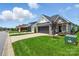 Charming single-Gathering home features a stone facade, manicured lawn, and well-maintained landscaping at 6277 Raven Rock Dr, Denver, NC 28037