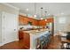 Gourmet kitchen with stainless steel appliances, granite countertops, and a breakfast bar with seating at 6277 Raven Rock Dr, Denver, NC 28037