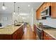 Gourmet kitchen with stainless steel appliances, granite countertops, and a view into the dining area at 6277 Raven Rock Dr, Denver, NC 28037