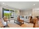 Inviting living room featuring sliding glass doors leading to the outside and hardwood flooring at 6277 Raven Rock Dr, Denver, NC 28037