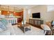 Living area with a partial view of the kitchen, a modern TV, and comfortable seating at 6277 Raven Rock Dr, Denver, NC 28037