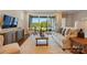 Comfortable living room with large sliding glass doors leading to the outside and neutral décor at 6277 Raven Rock Dr, Denver, NC 28037