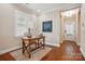 Bright office with hardwood floors, a world map, and a view of the entryway at 6277 Raven Rock Dr, Denver, NC 28037